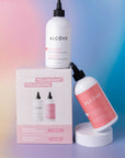 Alcove volumizing hair product with bottles and packaging on a gradient background