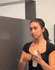 Gif showing someone in a bathroom using the Alcove Hair Strong Hold Hairspray