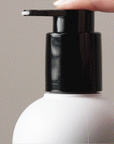 Gif showing someone press on the Mini Styling Cream - Alcôve Hair pump with liquid coming out