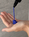 Gif of someone pouring the Alcôve Hair Violet Conditioner in their palm