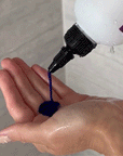 Gif showing someone pour Violet Shampoo - Alcôve Hair into their hand in the shower