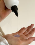 Person pouring the Alcove Hair Hydrating Shampoo in her hand