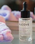 Bottle of Alcove Hair Pre-Wash Scalp Oil lifestyle