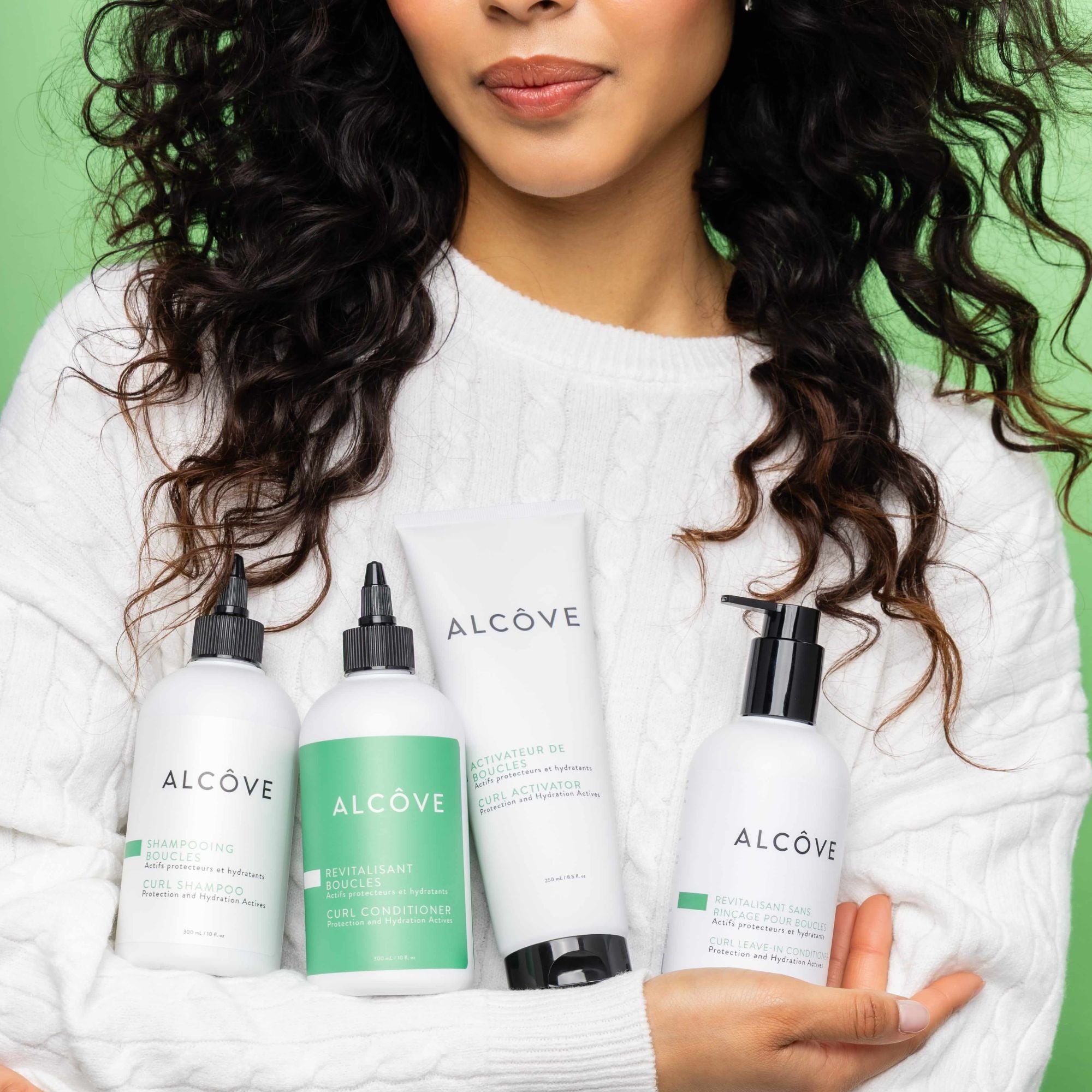 Image showing a woman holding the entire line of Alcôve Curl products