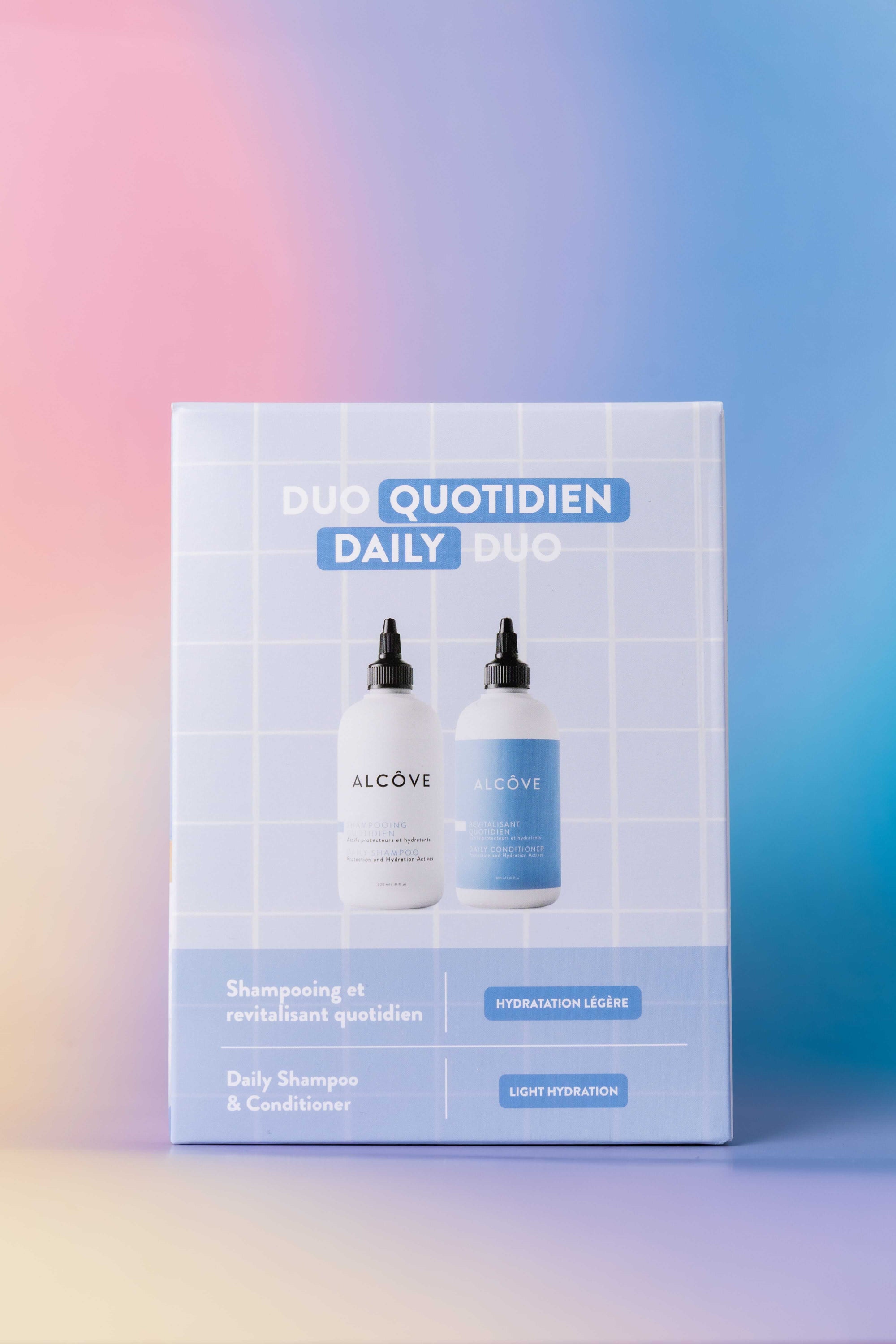Alcove Duo Quotidien daily duo packaging on a gradient background