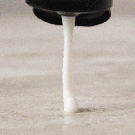 Gif showing the texture of the Alcôve Hair Restructuring Mask Travel Size 55ml coming out of a bottle