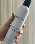 A picture of a hand showing the Alcove Hair Dry Shampoo - 170g - 6oz