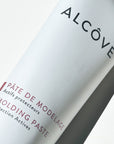 A close up of the Alcove Hair Molding Paste 100 ml / 3.4 oz bottle in a white background.